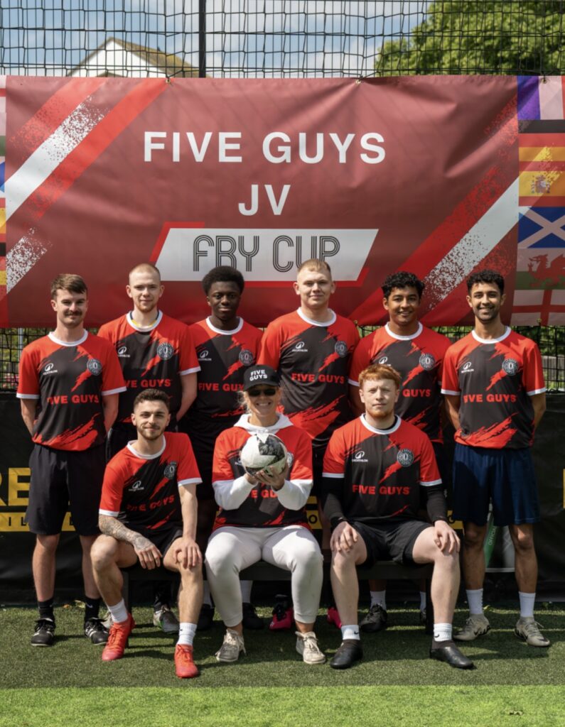Le Bosh FC in their custom red and black Decathlon football kit with 'FIVE GUYS' logo.