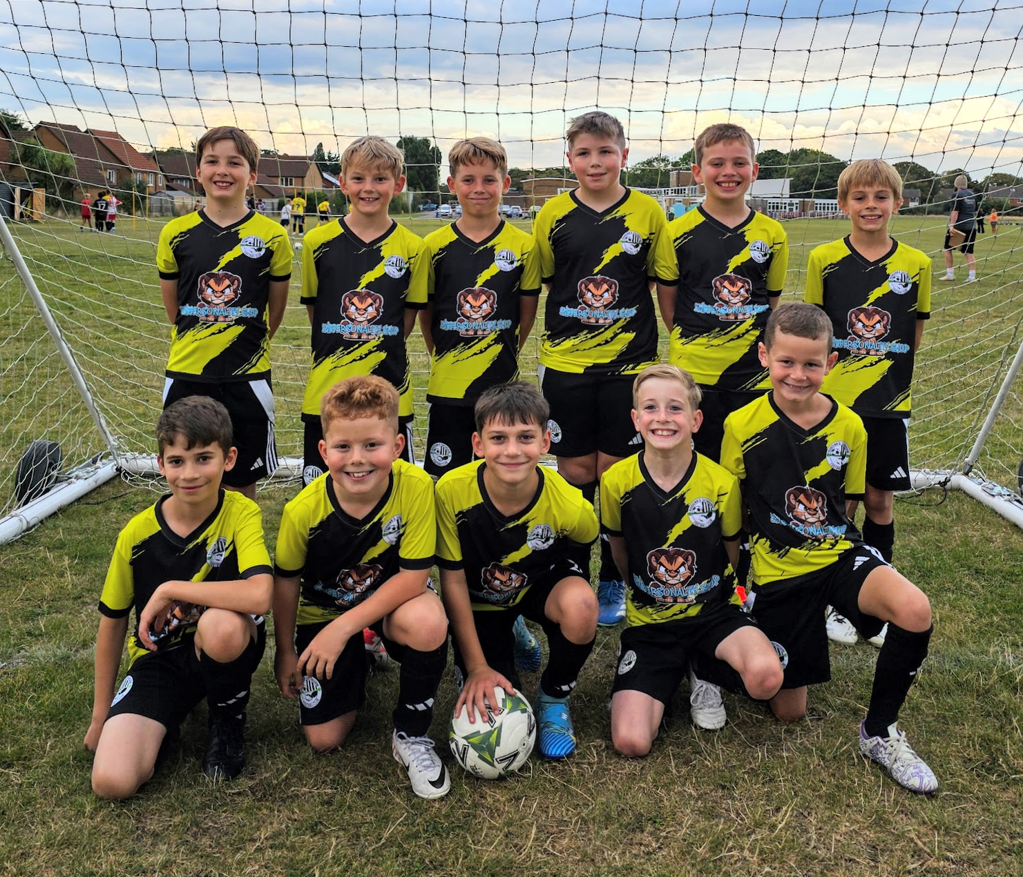Moordown and Southbourne FC U10s Lions in custom Decathlon sports kit. A green and black design with lion emblem.
