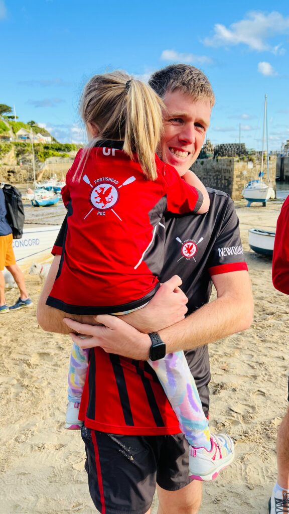 Portishead PGC custom kit worn by father holding daughter in her custom kit, too.